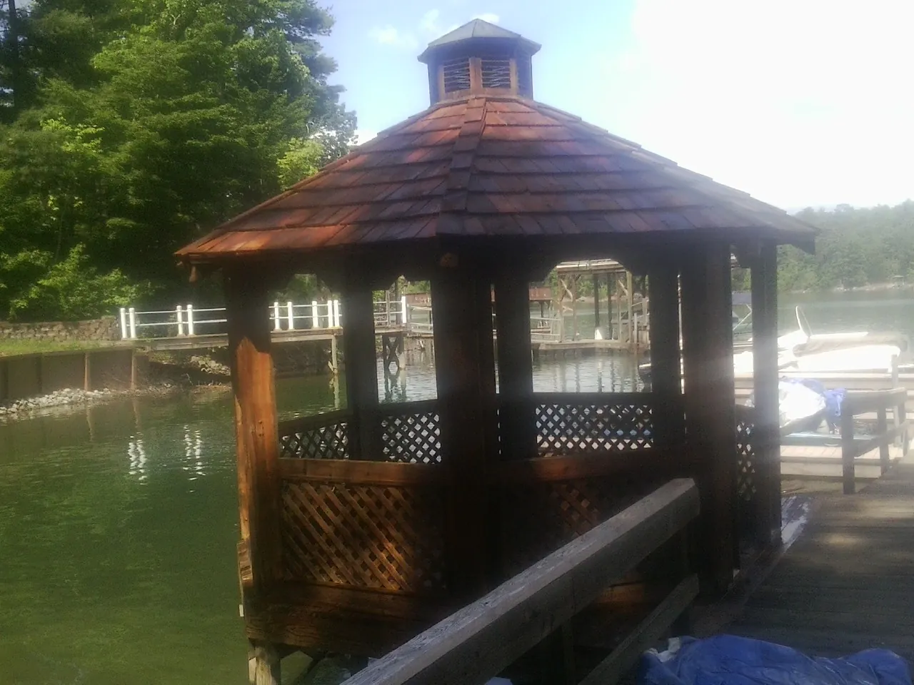 Cedar shake gazebo roof rebuilt on a lake dock in Mackville